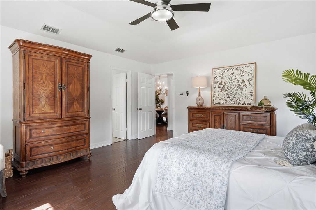 616 Colonial Drive Portland, TX 78374 - Photo 15 of 35 a bedroom with a bed and a dresser