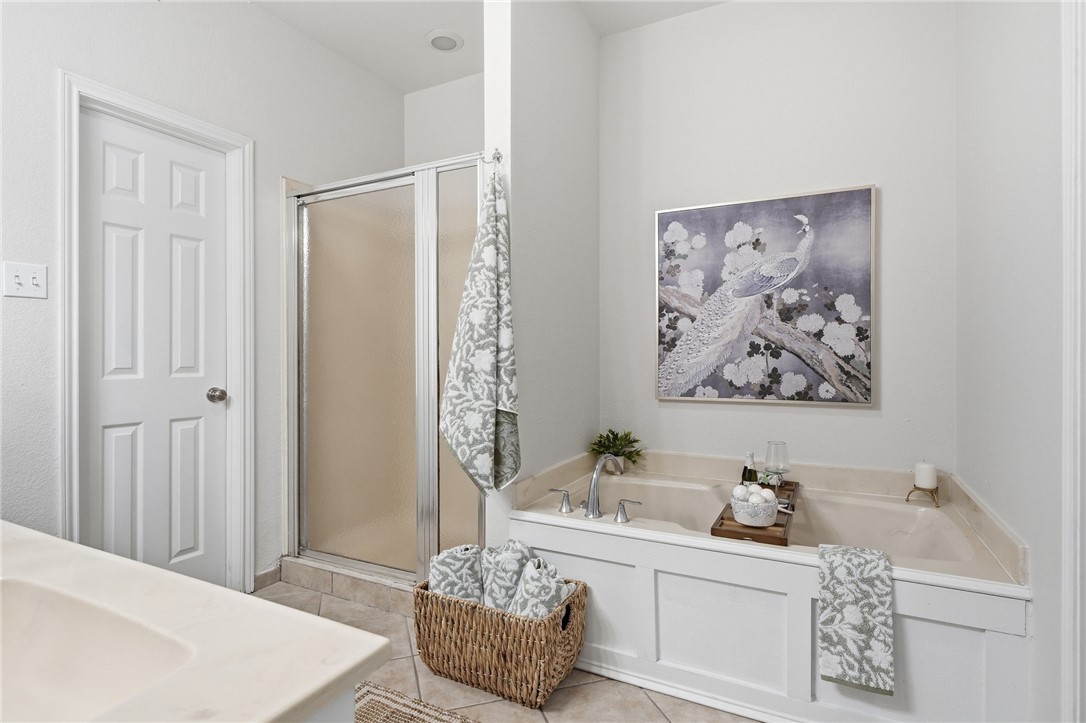 616 Colonial Drive Portland, TX 78374 - Photo 16 of 35 a spacious bathroom with a tub and sink