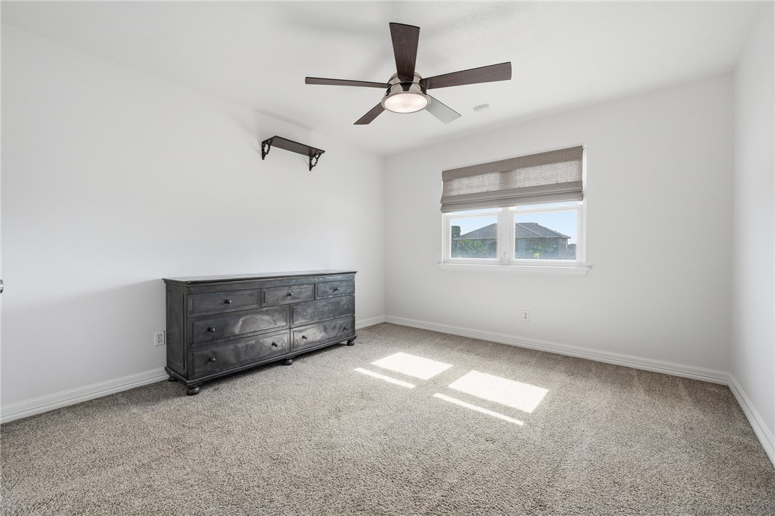 616 Colonial Drive Portland, TX 78374 - Photo 23 of 35 an empty room with windows and fan