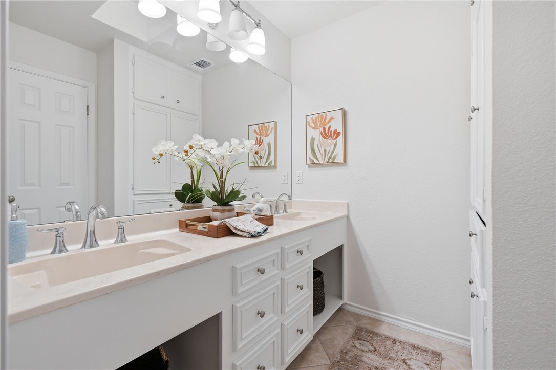 616 Colonial Drive Portland, TX 78374 - Photo 24 of 35 a bathroom with a sink a mirror and a shower