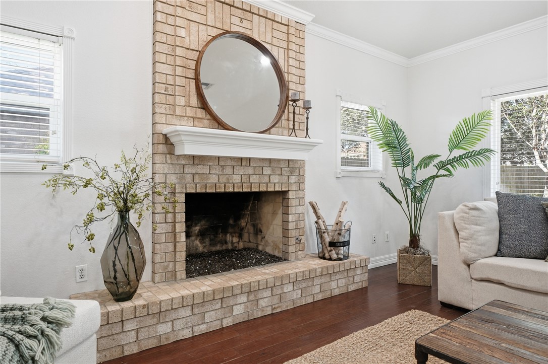 616 Colonial Drive Portland, TX 78374 - Photo 8 of 35 a living room with furniture a fireplace and a potted plant