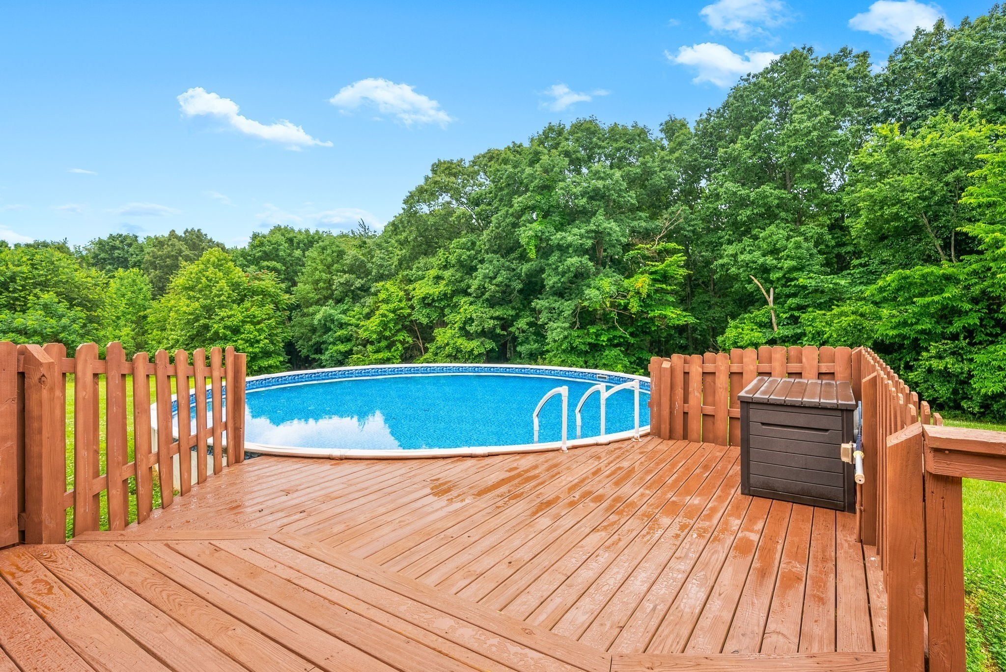 2430 Underwood Road Cunningham, TN 37052 - Photo 32 of 49 a view of a wooden deck and a backyard