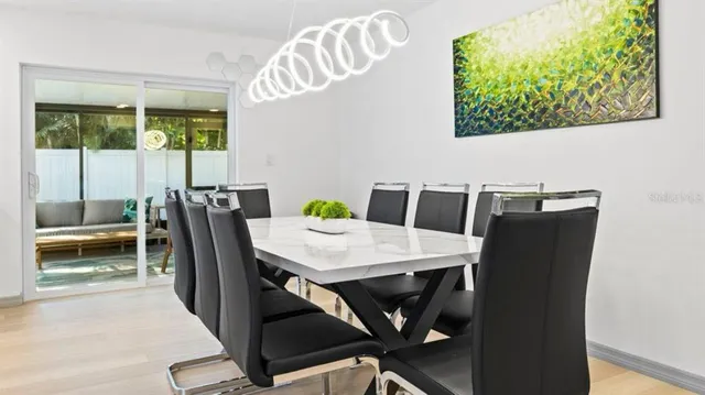 a view of a dining room with furniture and window
