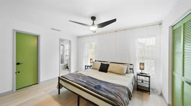 a bedroom with a bed and a window