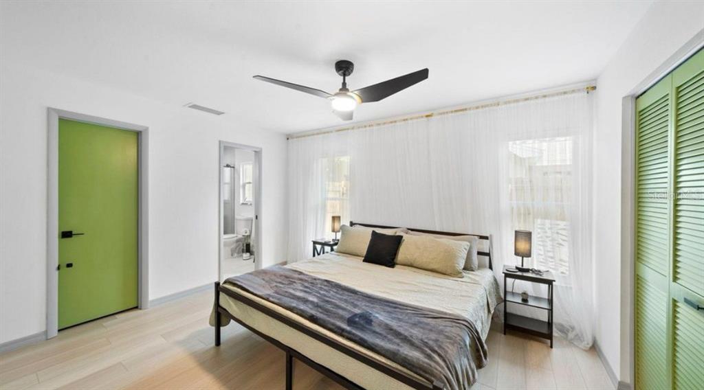 11123 117th Way Largo, FL 33778 - Photo 7 of 13 a bedroom with a bed and a window