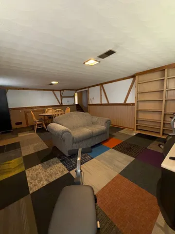 a view of a chairs and table in a room