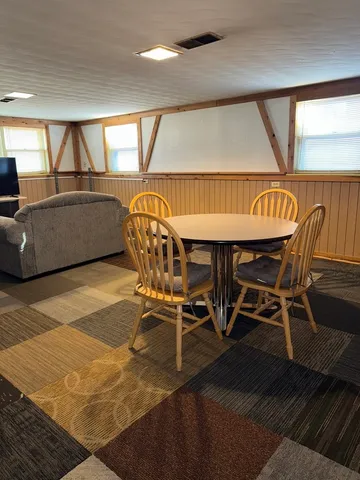 a view of a dining room with furniture