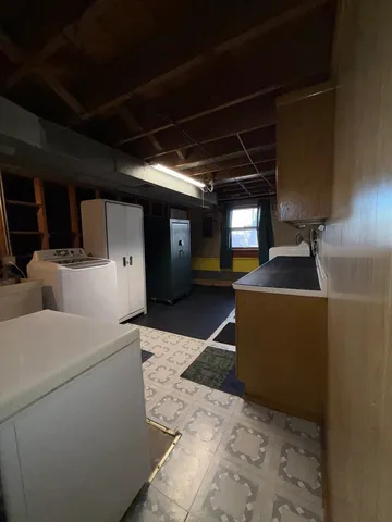 a kitchen with stainless steel appliances kitchen island granite countertop a sink and cabinets