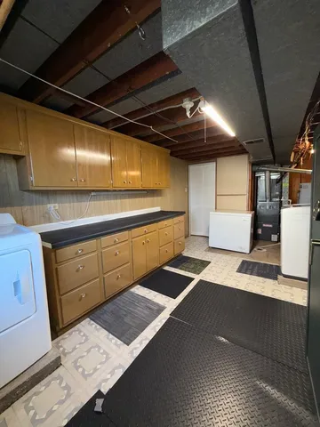 a view of a backyard with a large tree