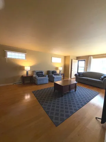 a living room with couch and a table