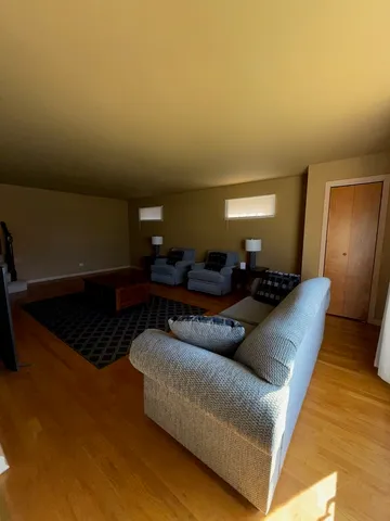 a living room with furniture and a rug