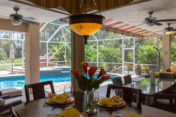 a bedroom with a large bed and a large window