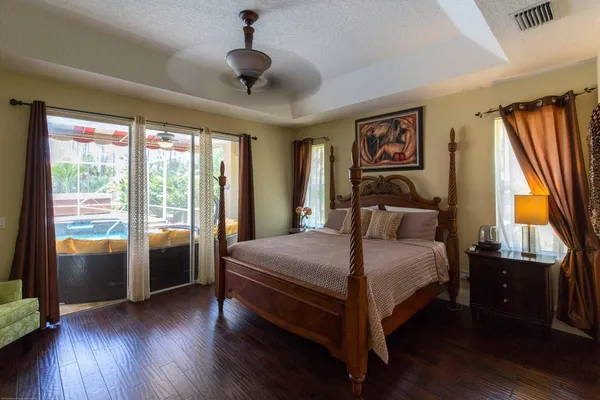 a bedroom with a bed and cabinets