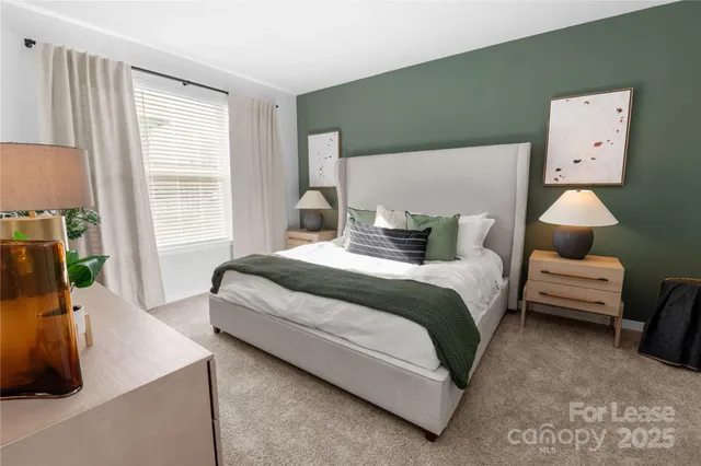 a bedroom with a bed and a couch