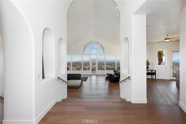 a living room with furniture fireplace and a window