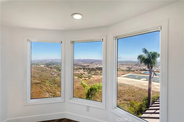 a view of a living room and a balcony