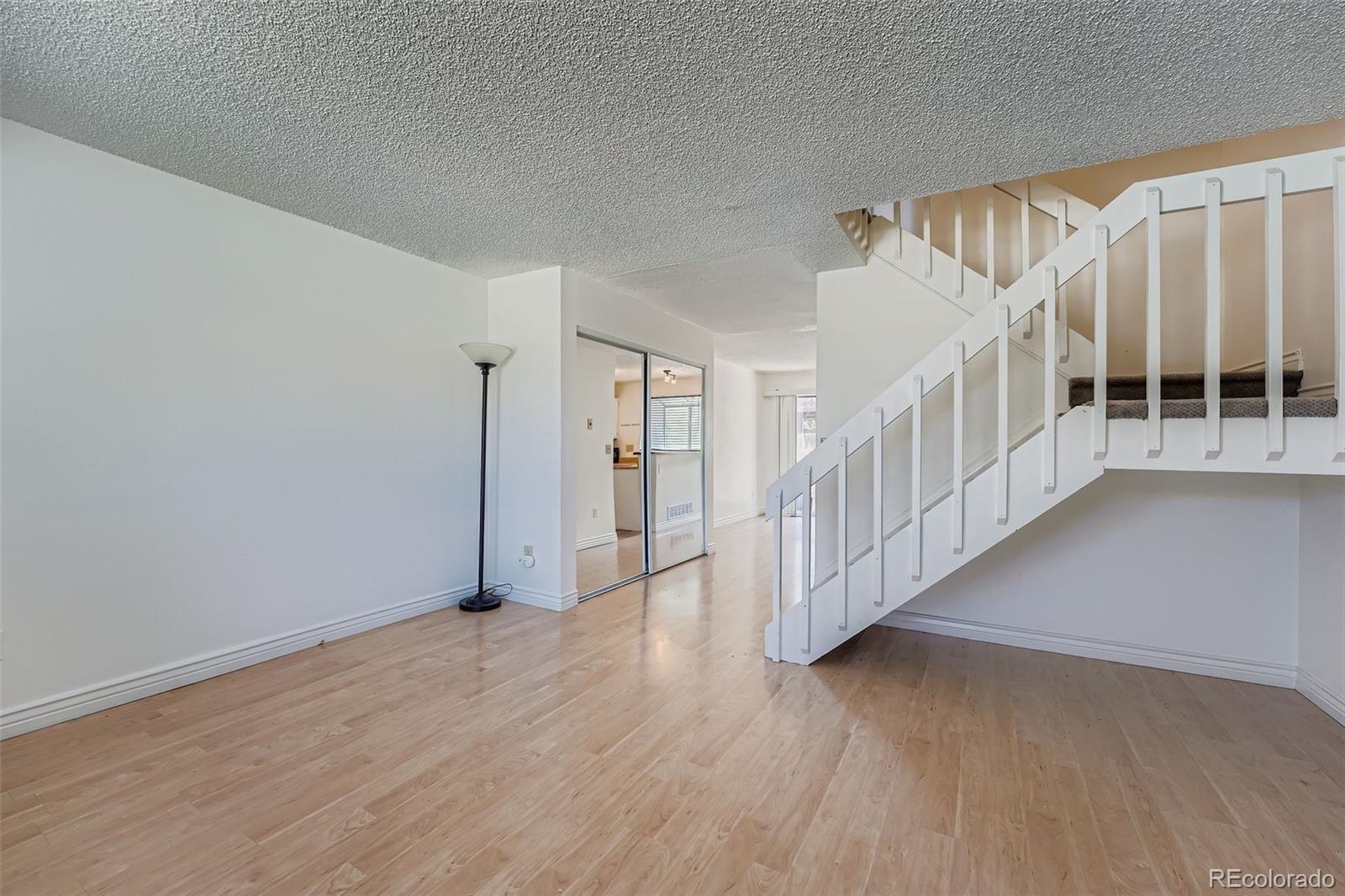 17315 East Rice Circle, Unit G Aurora, CO 80015 - Photo 11 of 31 a view of entryway with wooden floor