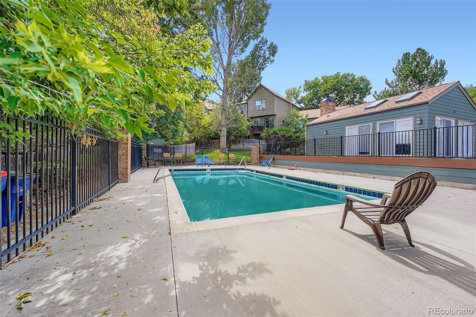 17315 East Rice Circle, Unit G Aurora, CO 80015 - Photo 26 of 31 a view of a house with backyard porch and sitting area