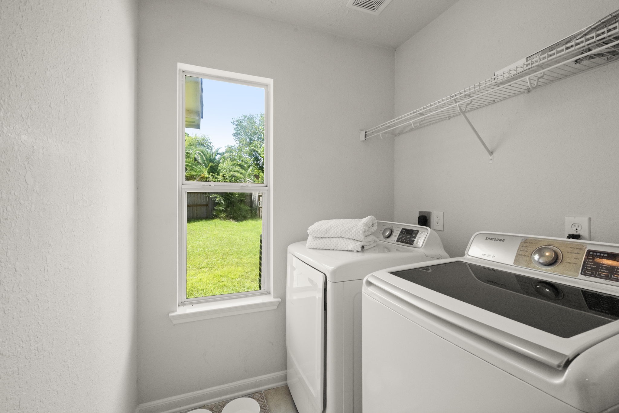 19819 Rippling Brook Lane Tomball, TX 77375 - Photo 16 of 28 Even the laundry room is a bright space to work. Washer/Dryer will stay with the home.