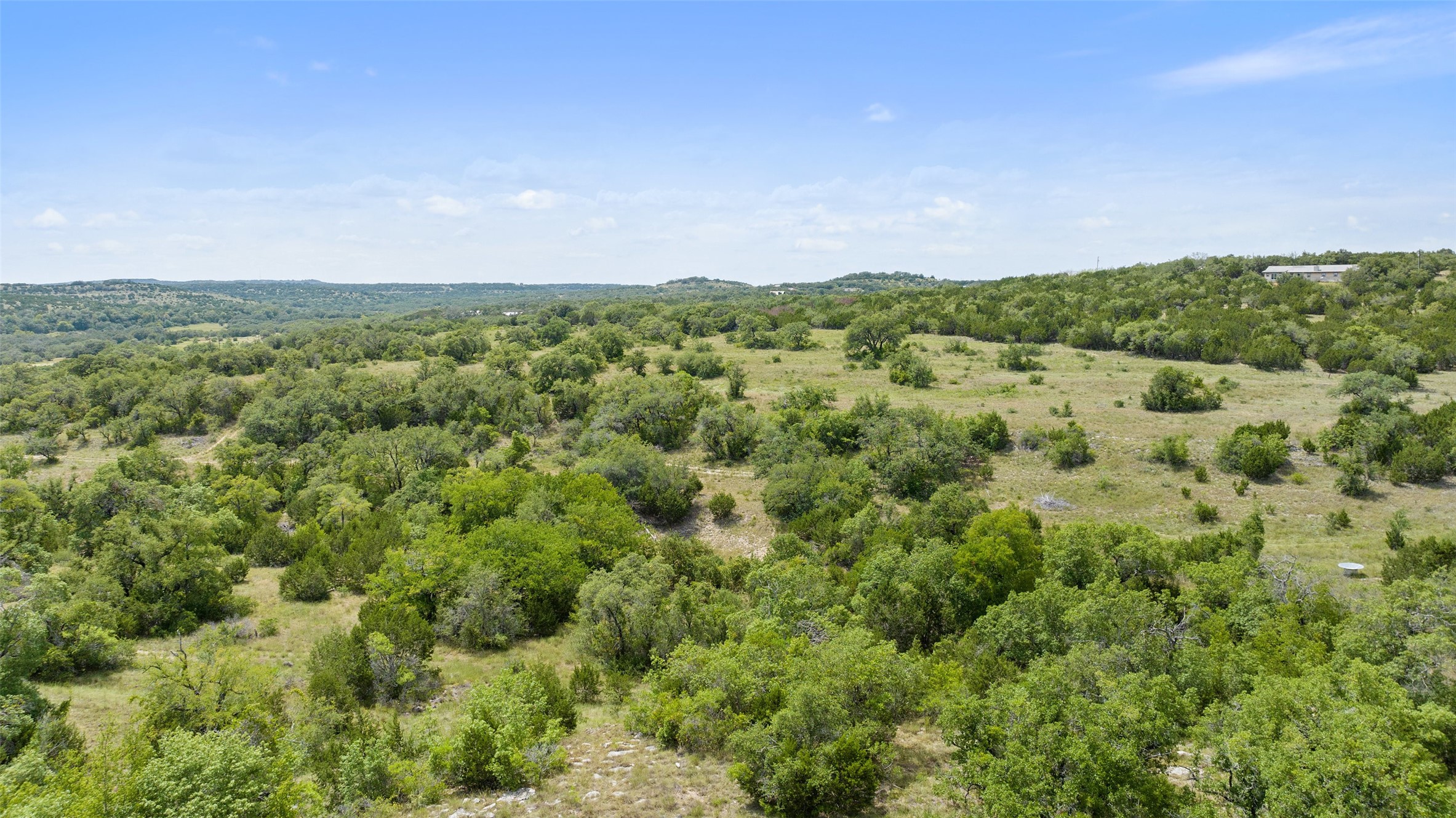 Tbd Fall Creek Road Spicewood, TX 78669 - Photo 1 of 13 a view of a green field