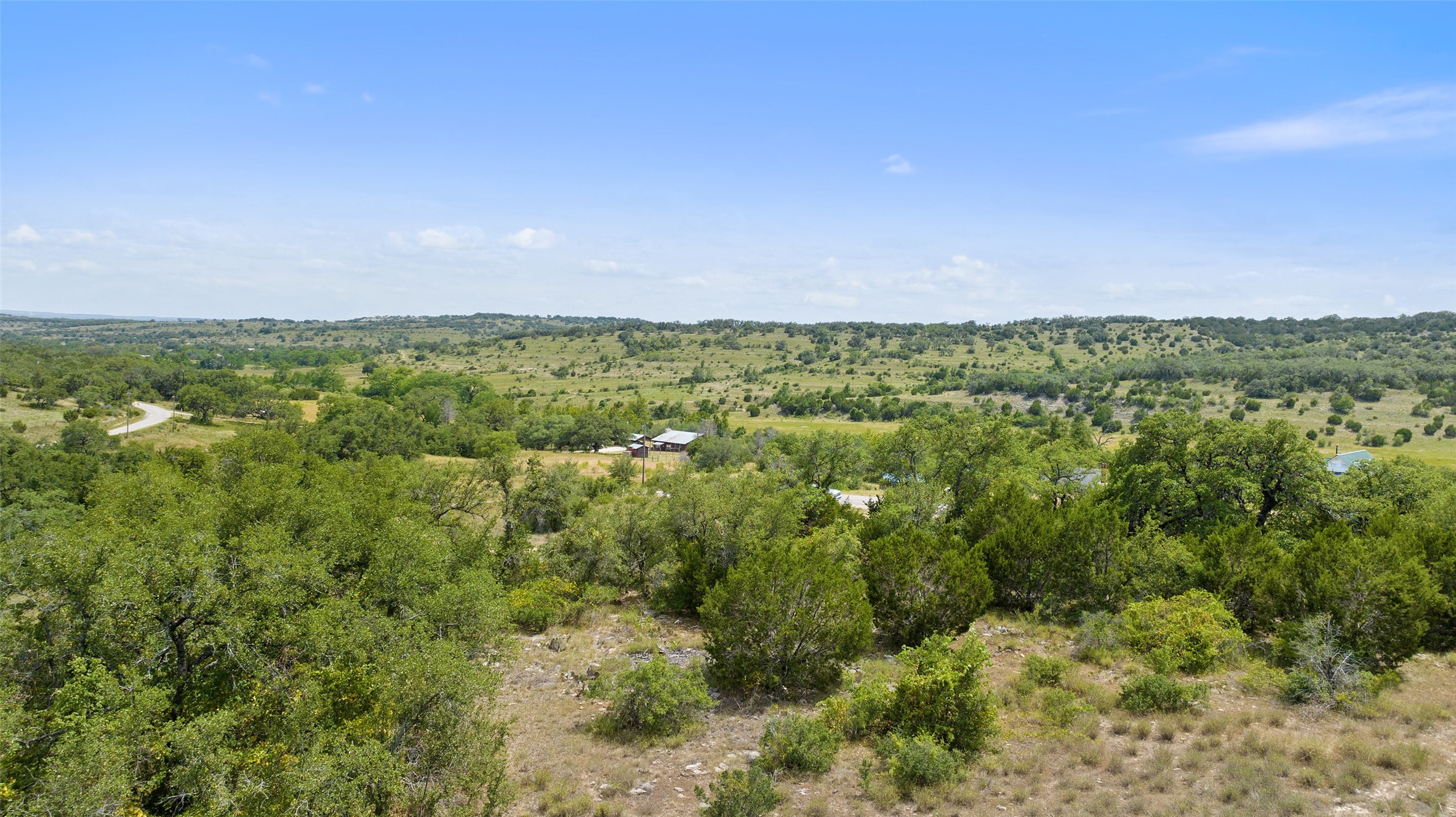 Tbd Fall Creek Road Spicewood, TX 78669 - Photo 5 of 13 a view of a city with lush green forest