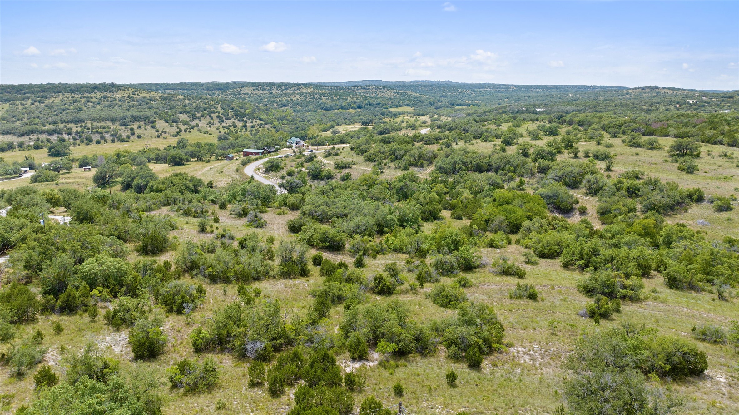Tbd Fall Creek Road Spicewood, TX 78669 - Photo 6 of 13 a view of a green field with lots of bushes