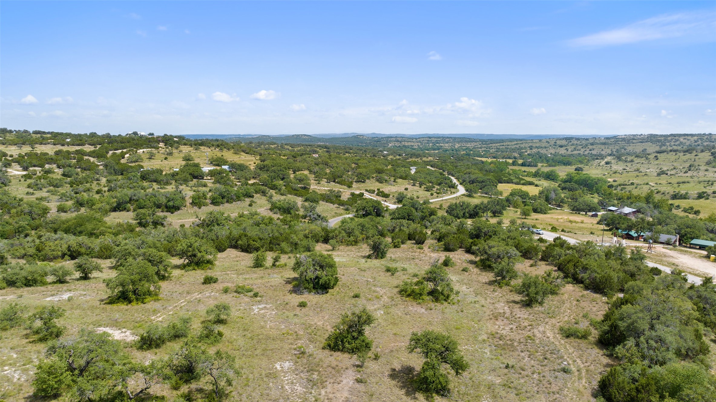 Tbd Fall Creek Road Spicewood, TX 78669 - Photo 8 of 13 a view of a city with lush green forest