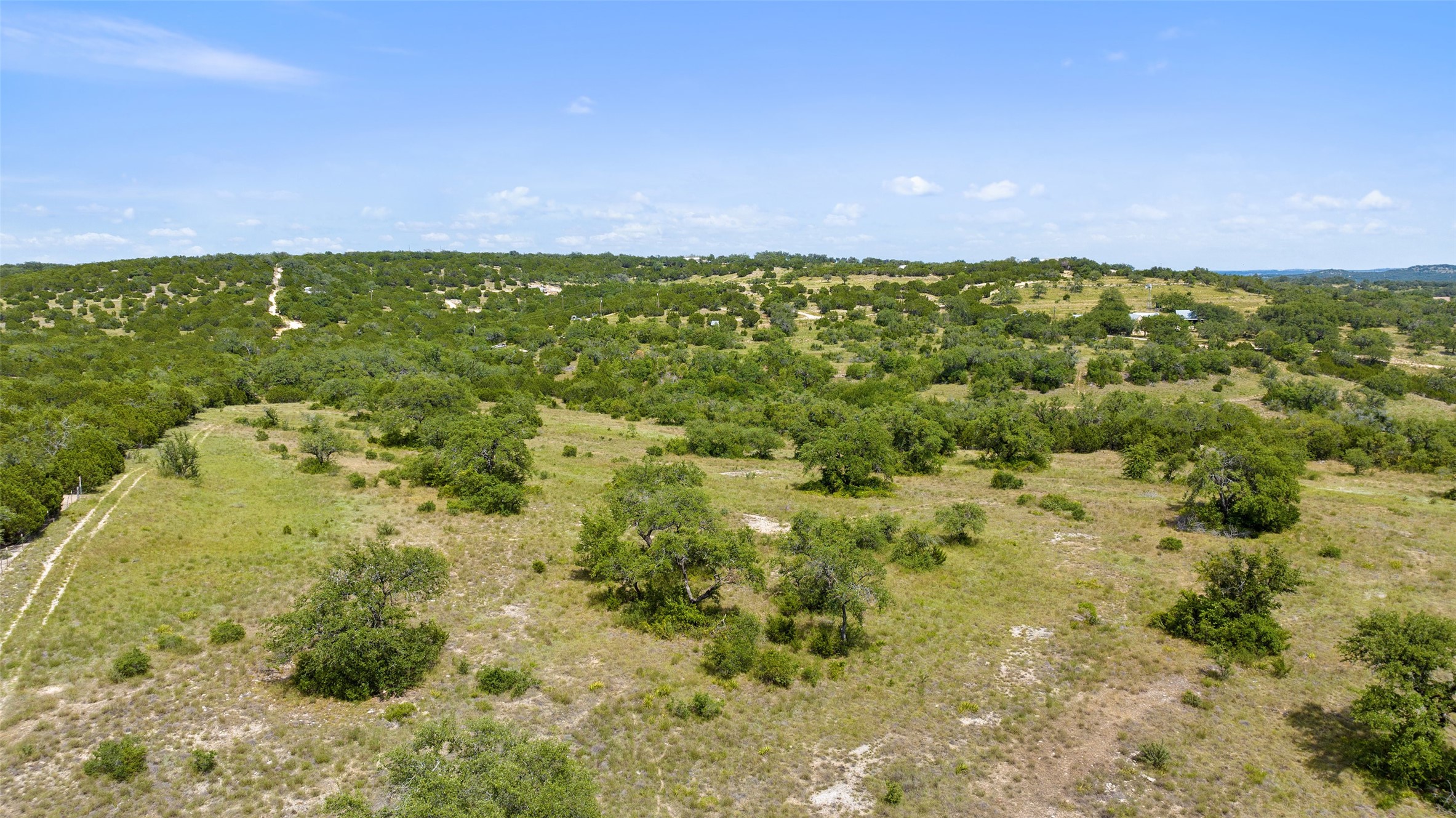 Tbd Fall Creek Road Spicewood, TX 78669 - Photo 10 of 13 a view of a yard with an trees and plants