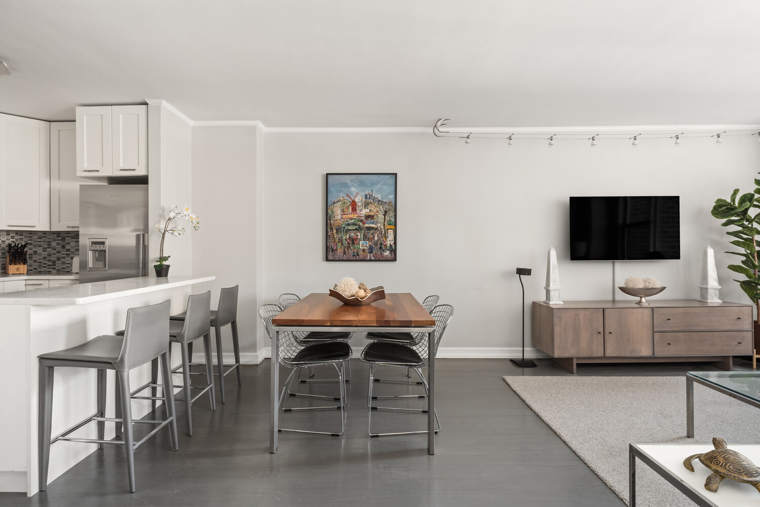 200 West 79th Street, Unit 12P Manhattan, NY 10024 - Photo 2 of 10 a living room with furniture and a flat screen tv