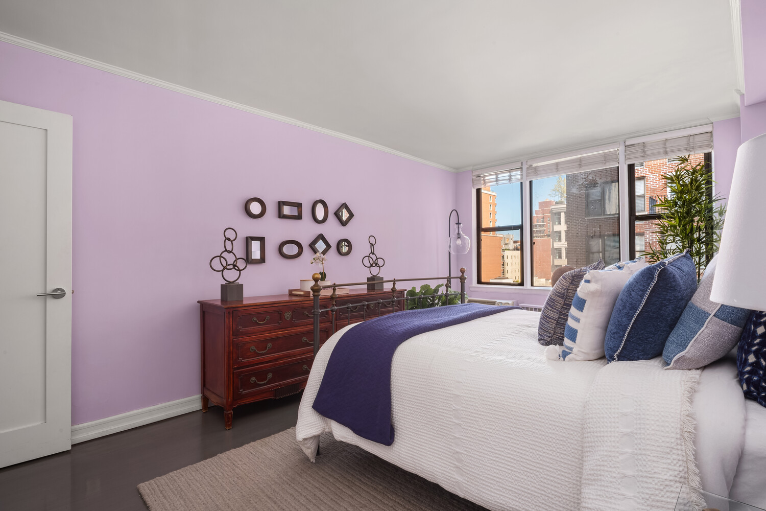 200 West 79th Street, Unit 12P Manhattan, NY 10024 - Photo 7 of 10 a bedroom with a bed and a dresser next to a window