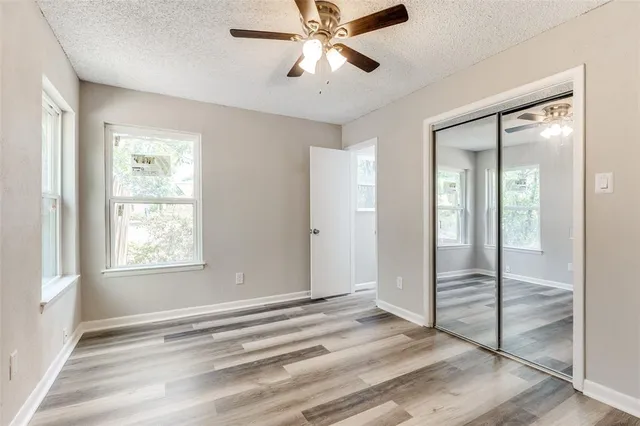 a view of room with window and ceiling fan