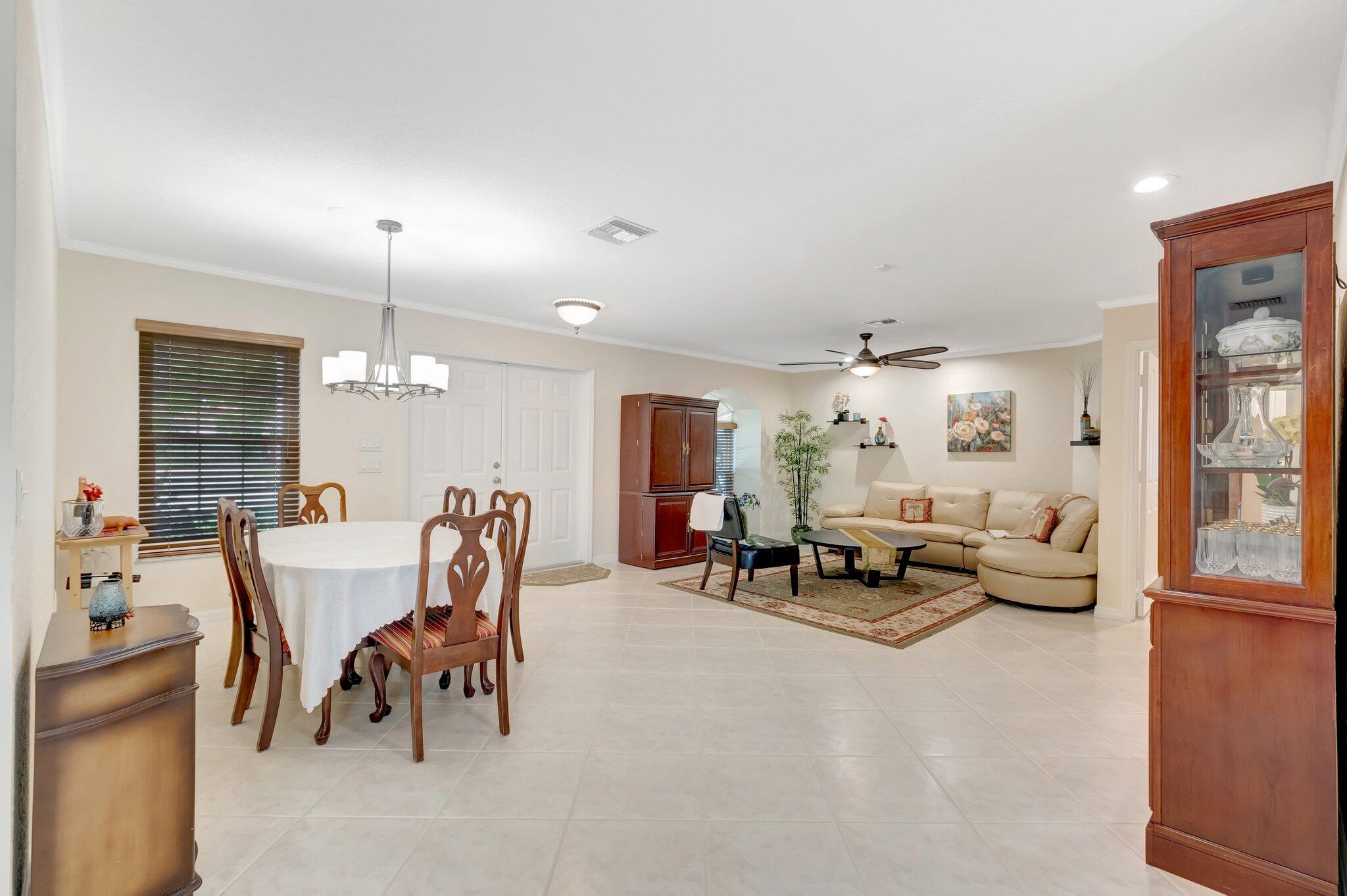 166 Southwest 8th Avenue Boca Raton, FL 33486 - Photo 5 of 25 a living room with furniture and a large window