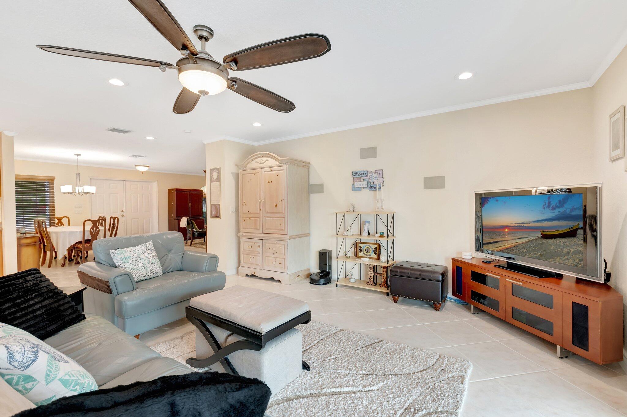 166 Southwest 8th Avenue Boca Raton, FL 33486 - Photo 6 of 25 a living room with furniture and a flat screen tv