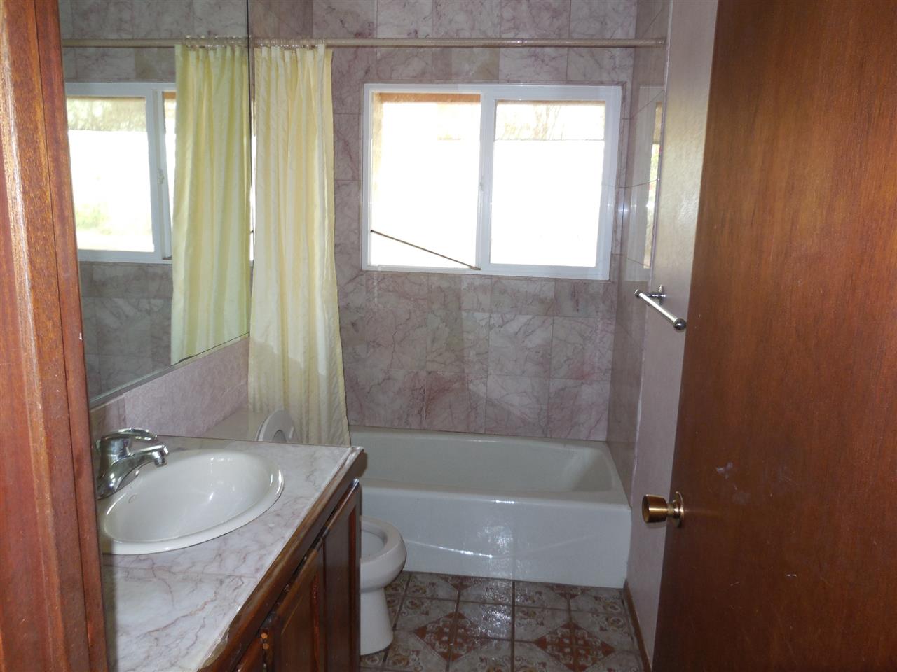 2850 Omaopio Road Kula, HI 96790 - Photo 14 of 20 a bath room with a sink toilet and shower