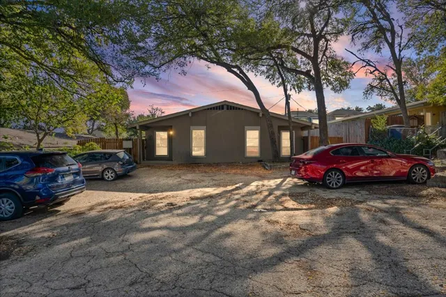 a view of a car parked in front of a house