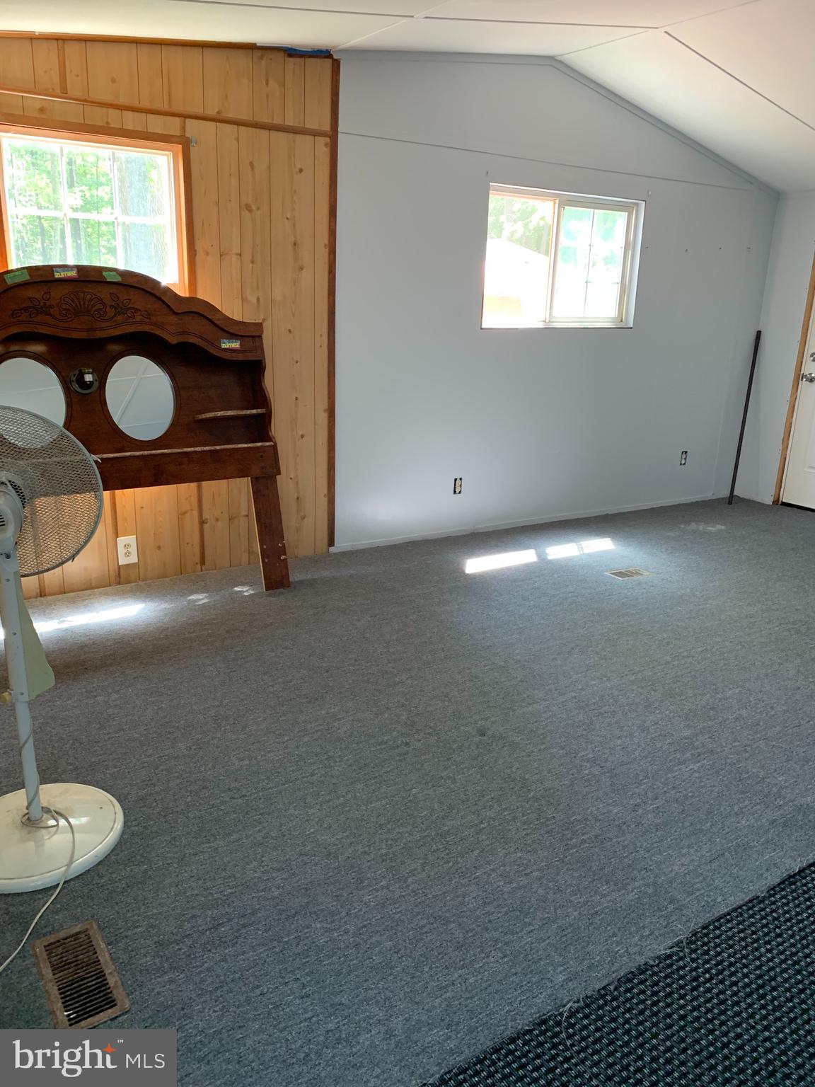 5816 Cornstack Road Marion Station, MD 21838 - Photo 8 of 9 a view of a room with wooden floor and furniture