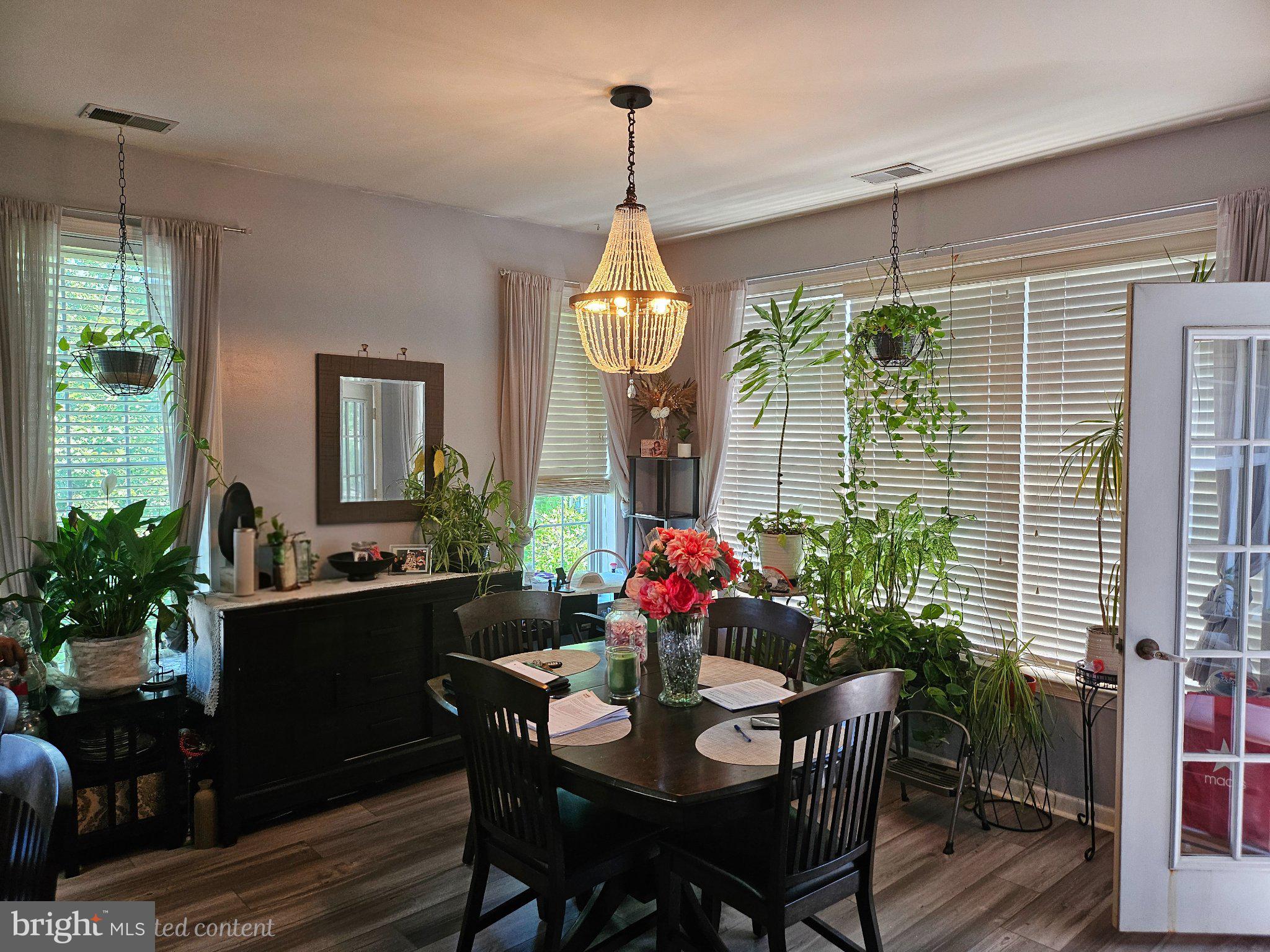 83 Kyle Way Ewing, NJ 08628 - Photo 11 of 36 Bright dining space with lush greenery.
