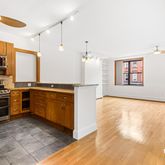 a kitchen with a stove a sink and a microwave