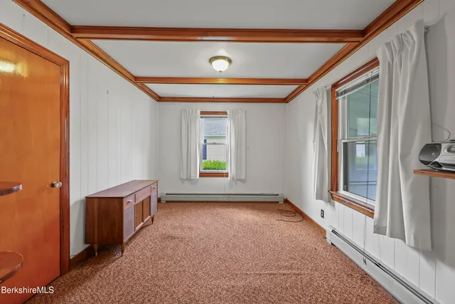 a bathroom with a sink a toilet and shower curtain
