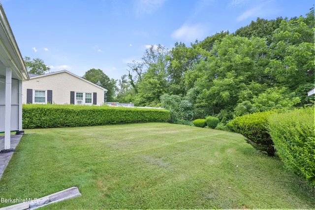 a picture of a bench in front of a window
