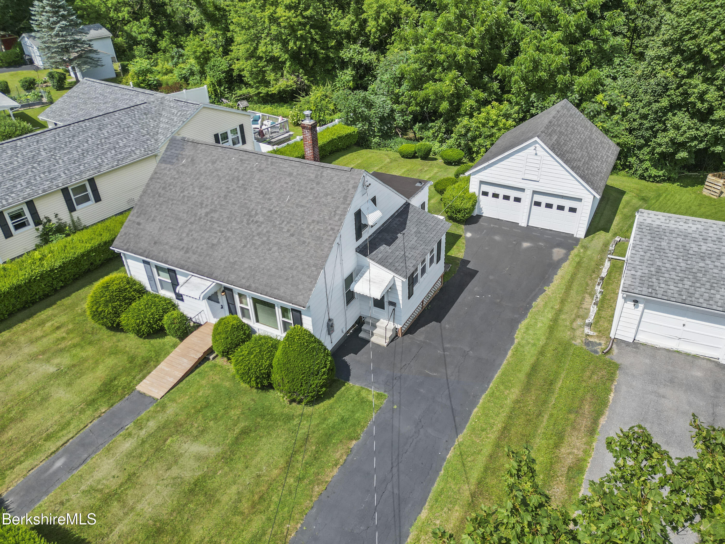 505 Barbour Street North Adams, MA 01247 - Photo 4 of 32 an aerial view of a house with a big yard and large trees