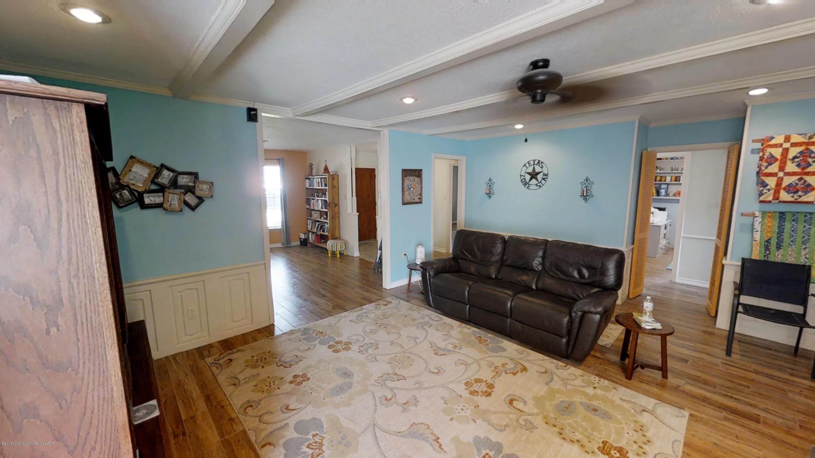 3308 Bedford Road Amarillo, TX 79106 - Photo 13 of 31 a living room with furniture and a wooden floor