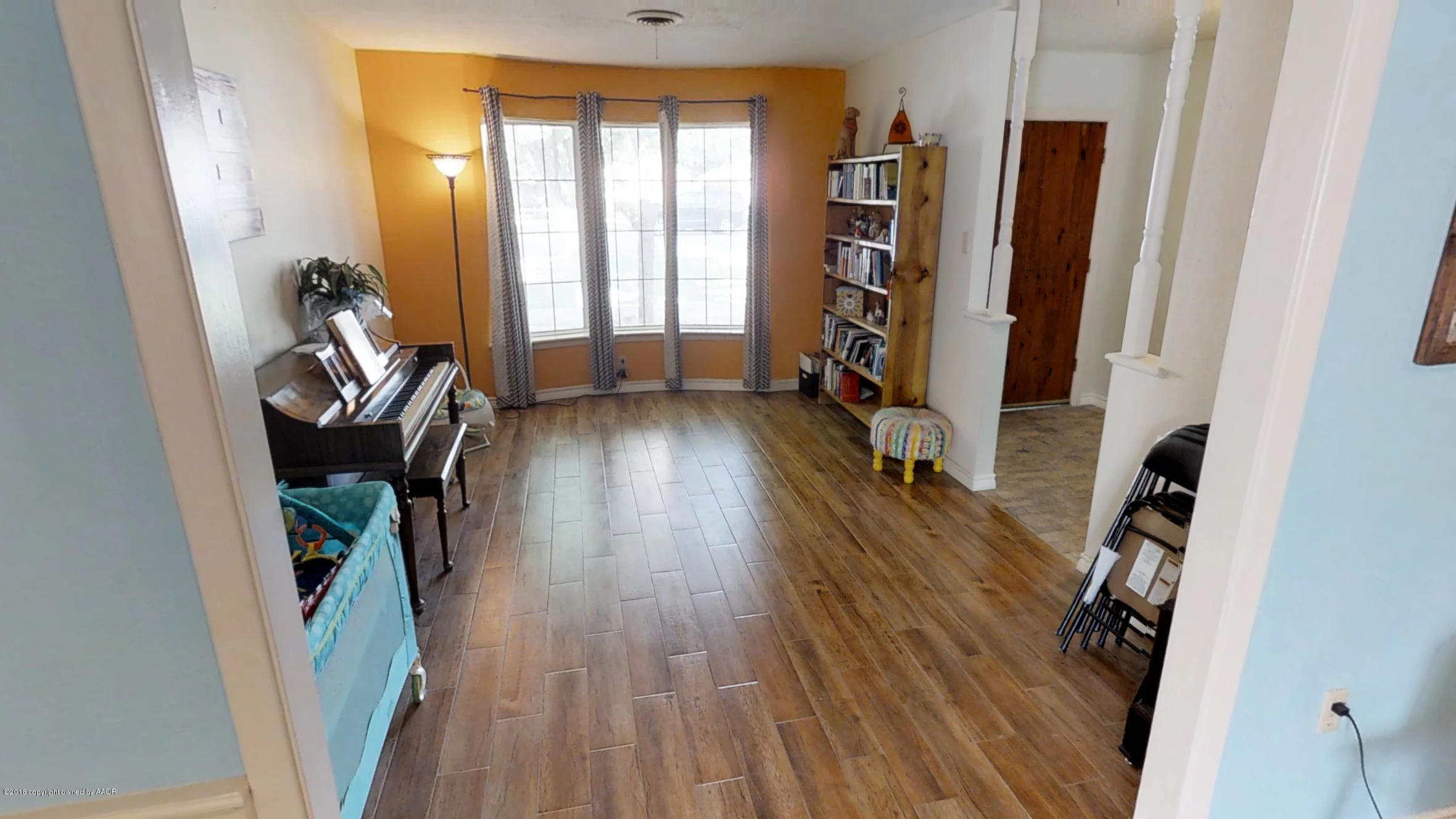 3308 Bedford Road Amarillo, TX 79106 - Photo 15 of 31 wooden floor in a room with a fireplace