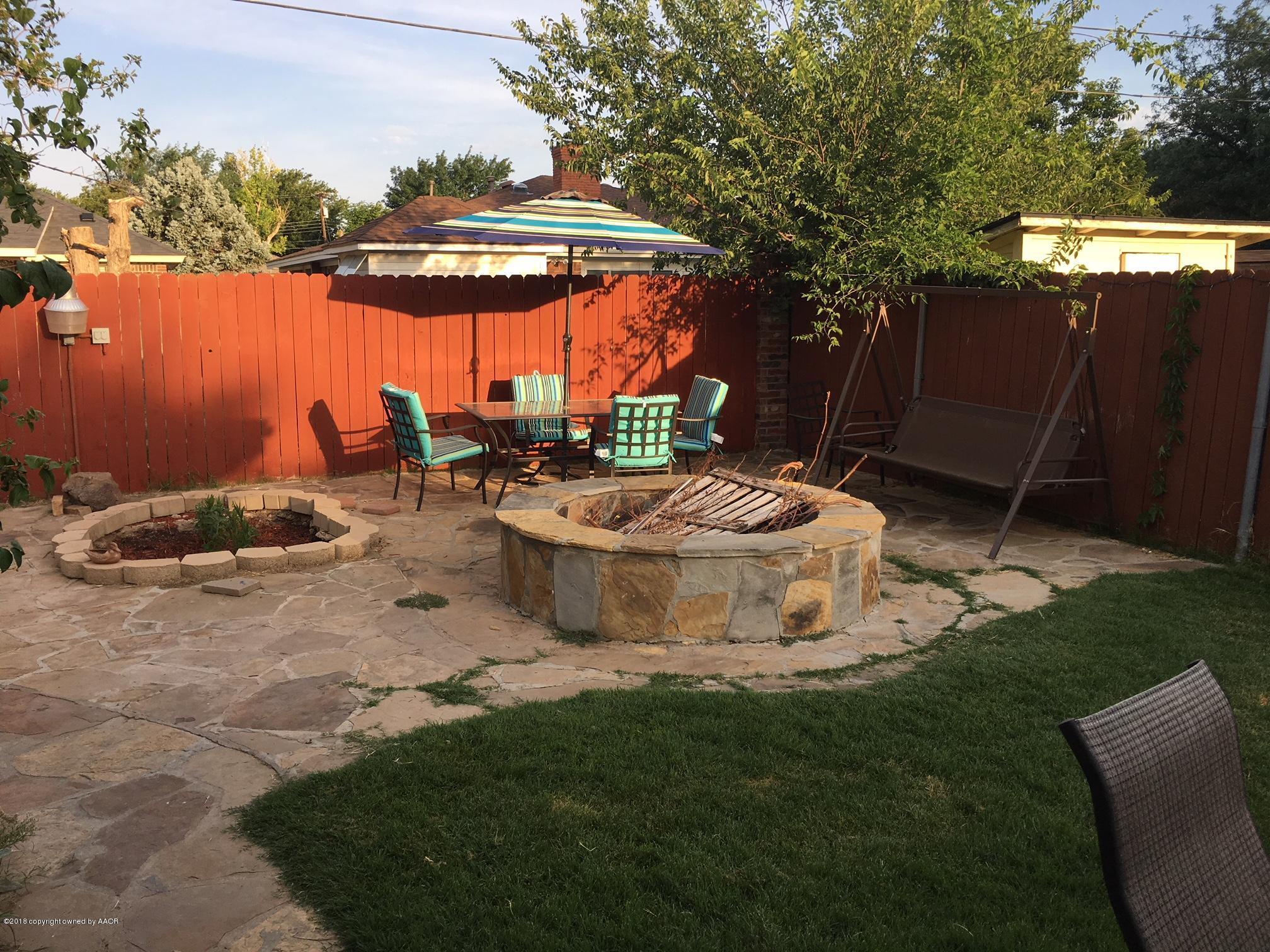 3308 Bedford Road Amarillo, TX 79106 - Photo 26 of 31 a view of a chair and table in backyard