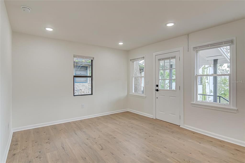 921 Southwest 6th Avenue, Unit B Gainesville, FL 32601 - Photo 9 of 18 an empty room with windows and closet