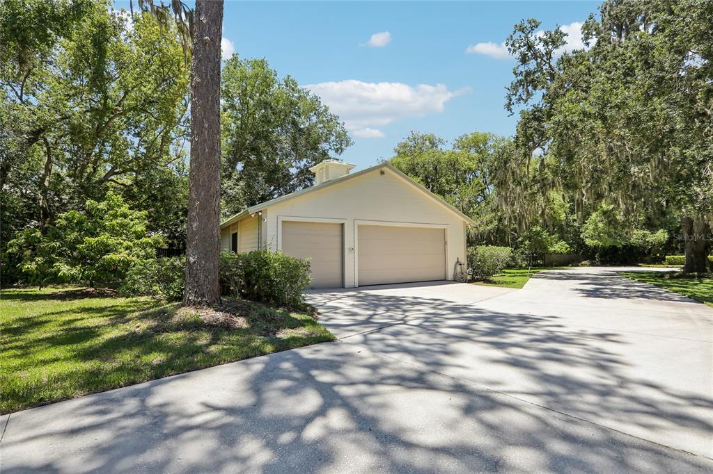 17810 Crawley Road Odessa, FL 33556 - Photo 60 of 76 a front view of a house with a yard and garage