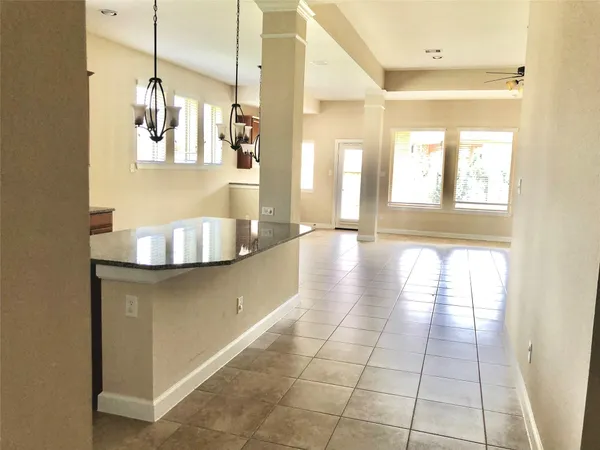 a room that has a window in it and kitchen view