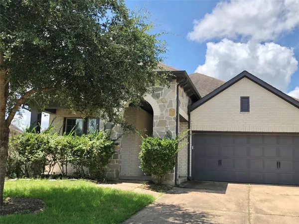 a view of a wooden house with a yard