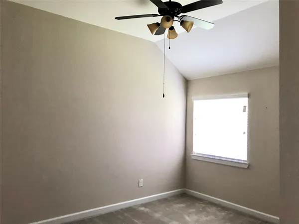 a bathroom with a tub sink and shower
