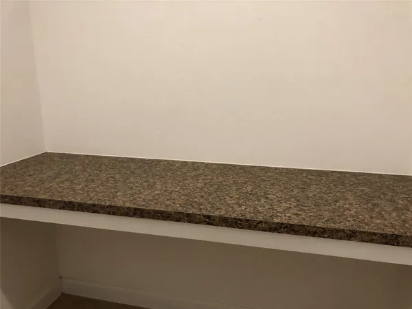 a view of a door and wooden roof